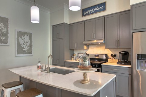 a kitchen with a counter top and a sink